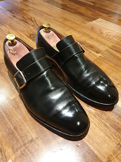 Pair of black Ducker monk shoes after a shoeshine